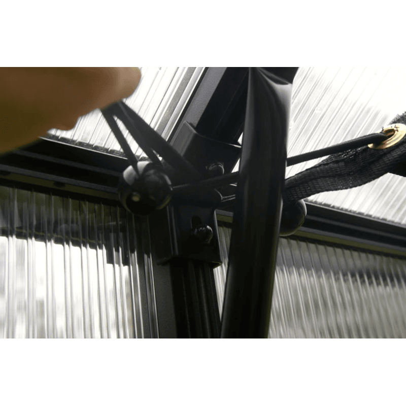 person fastening the rsi bungee balls for securing the shade cloth