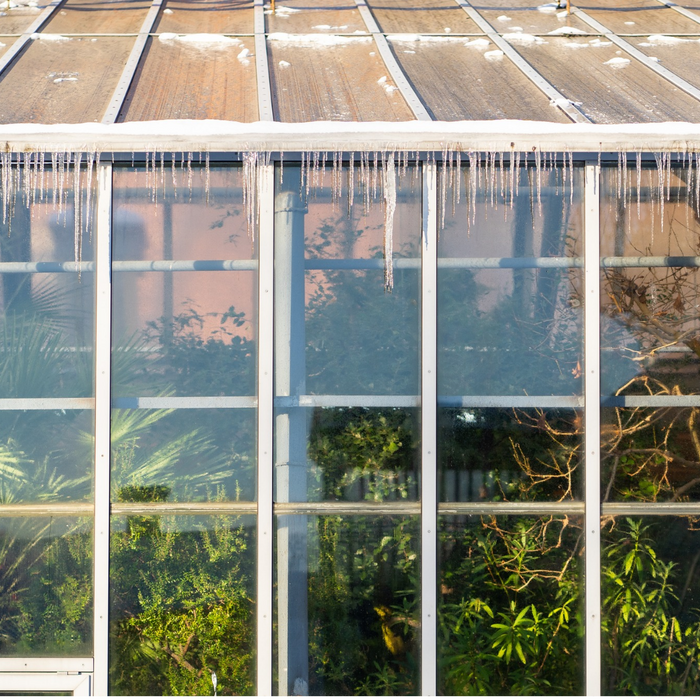 Heating a greenhouse in a backyard in winter