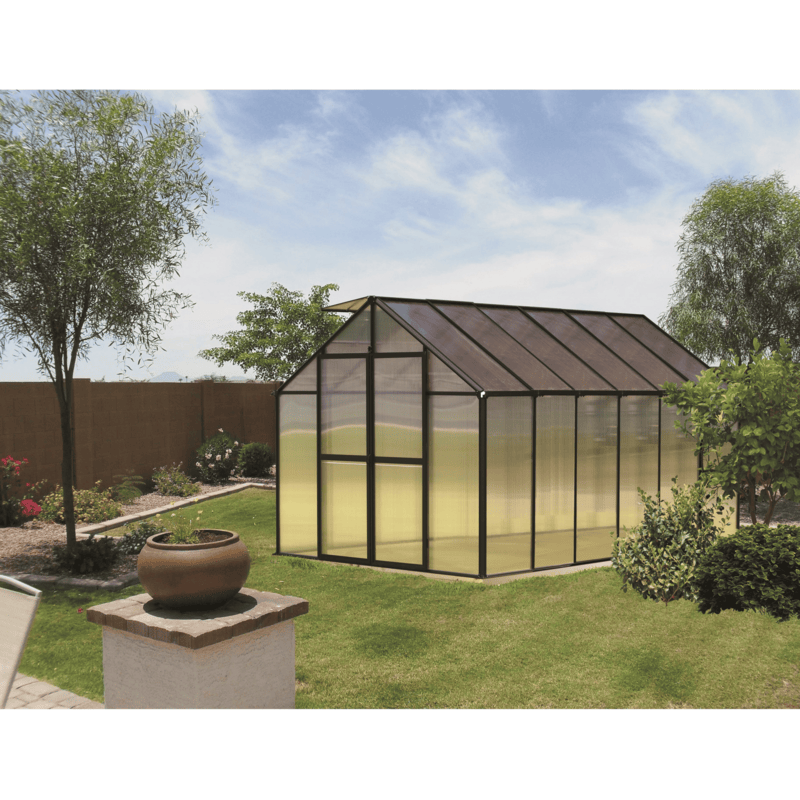 garden setting of the 12ft black monticello premium greenhouse 