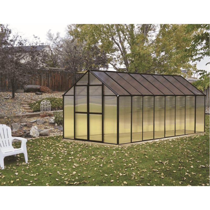 garden setting of the 16ft black monticello premium greenhouse 