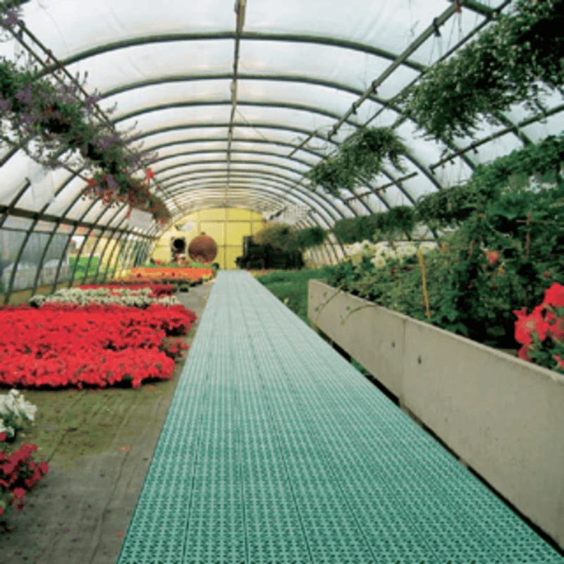 Greenhouse interior image with RSI interlocking floor system