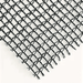 close up image of RSI knitted black shade cloth with grommets with 30% shade level 