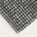 close up image of RSI knitted black shade cloth with grommets with 50% shade level 
