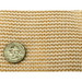 close up image of RSI white tropical weather shade cloth with grommets with a quarter on top of it for scale.
