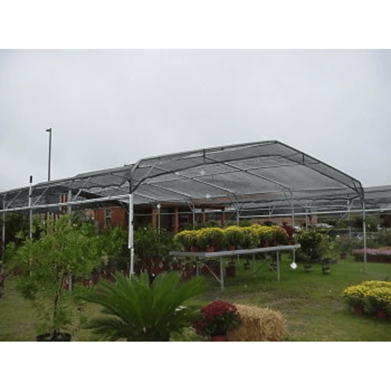 image of Riverstone Industries knitted black shade cloth with grommets used in a garden center