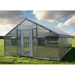 view of the riverstone industries thoreau premium growers edition educational greenhouse kit with 6ft high walls on a grassy area