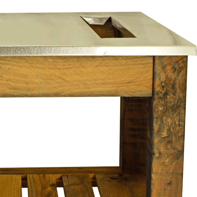 close up view of the waste disposal hole of the lee display gardener's pro potting table 