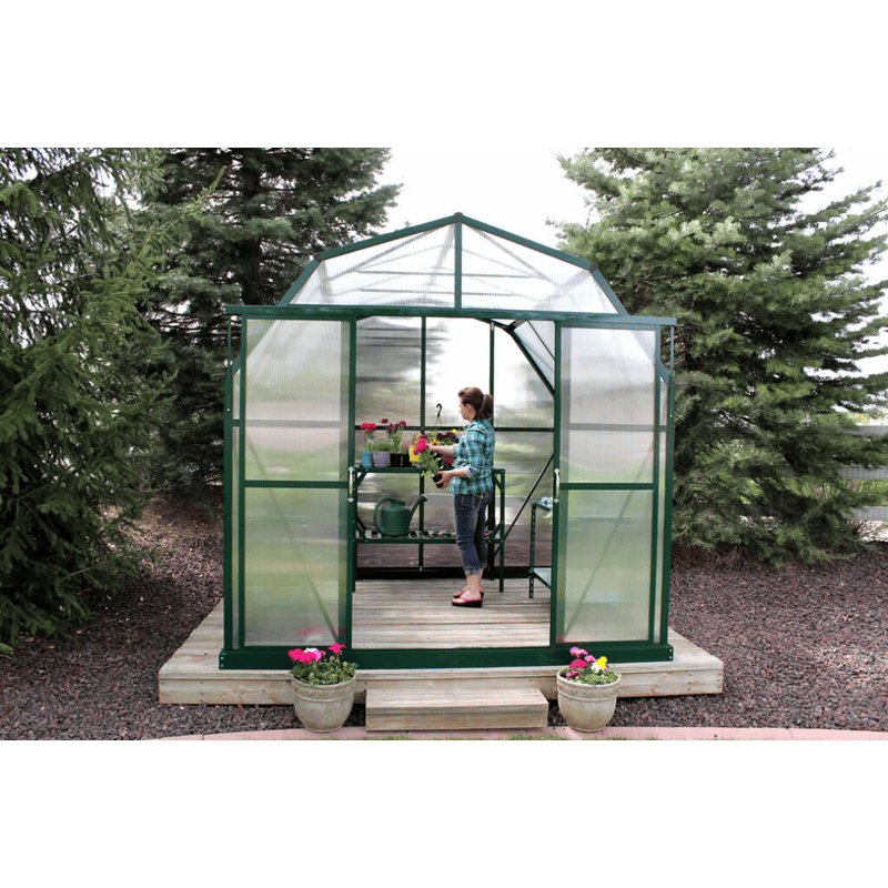 woman working in the grandio elite 8×12 greenhouse