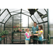 woman and children inside of the grandio elite 8×16 greenhouse