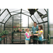 woman and kids working inside the grandio elite 8×20 greenhouse