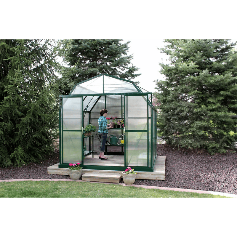 woman working inside the grandio elite 8×8 greenhouse