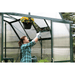 woman working with the roof vent of the gradio elite 8×8 greenhouse