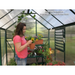 woman working in the grandio greenhouse element 6×12