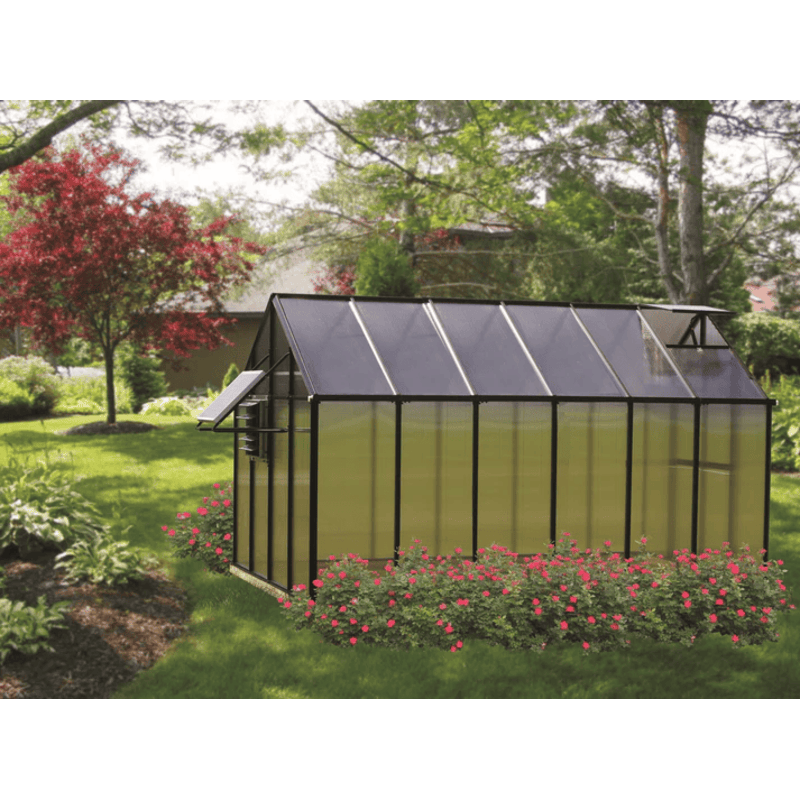 garden setting view of the monticello moheat greenhouse 12ft black edition
