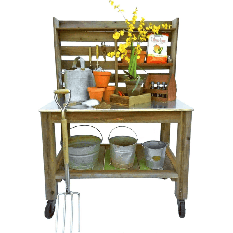 front view of the lee display redwood potting table with supplies on it
