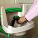 image of a person washing hands in a riverstone outdoor sink
