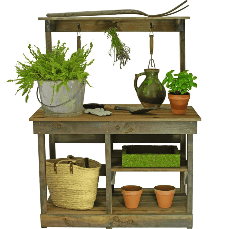 plants and tools on the lee display rustic gardening workbench