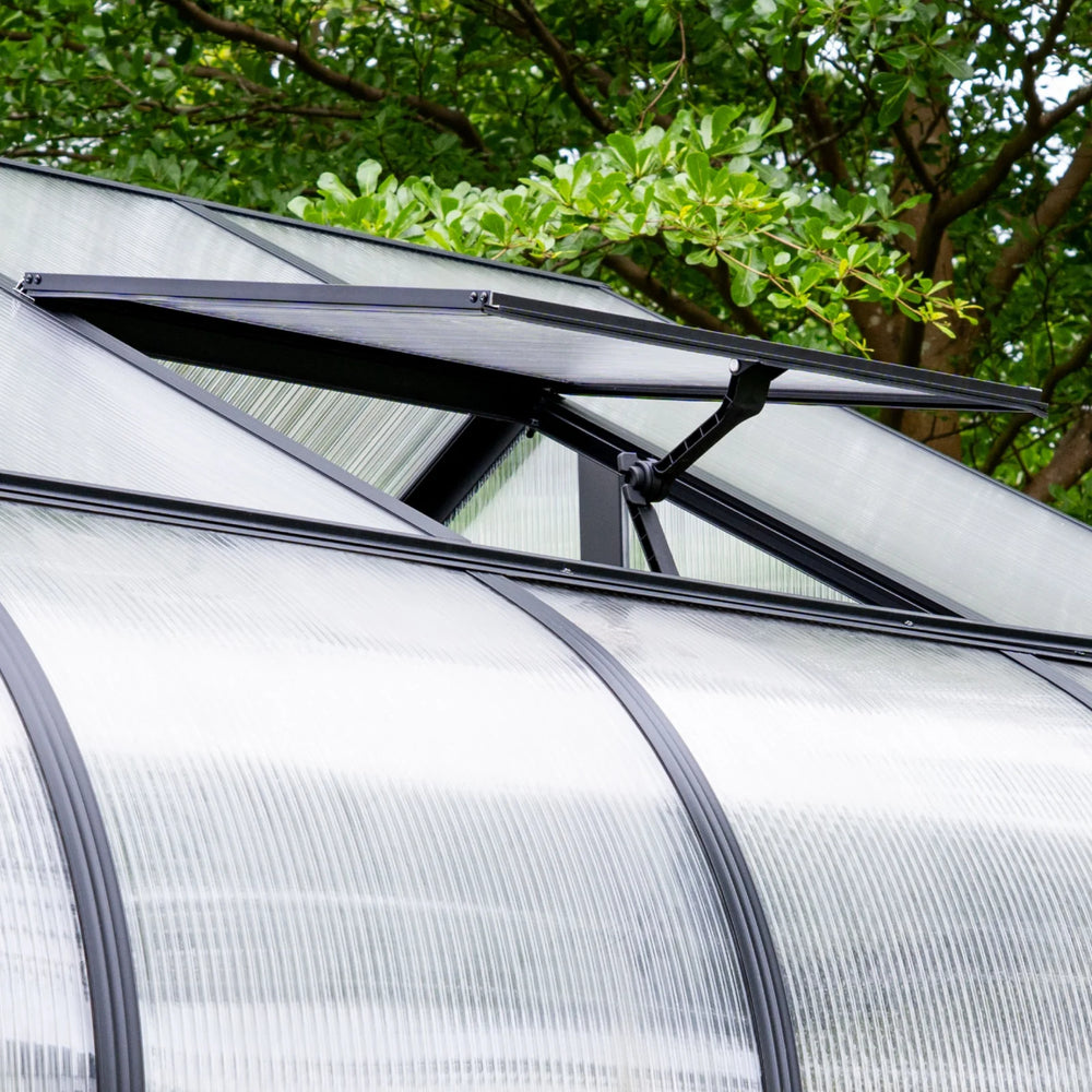 Close-up of an open adjustable roof vent and polycarbonate roofing on the Vego Garden Pacific Greenhouse.