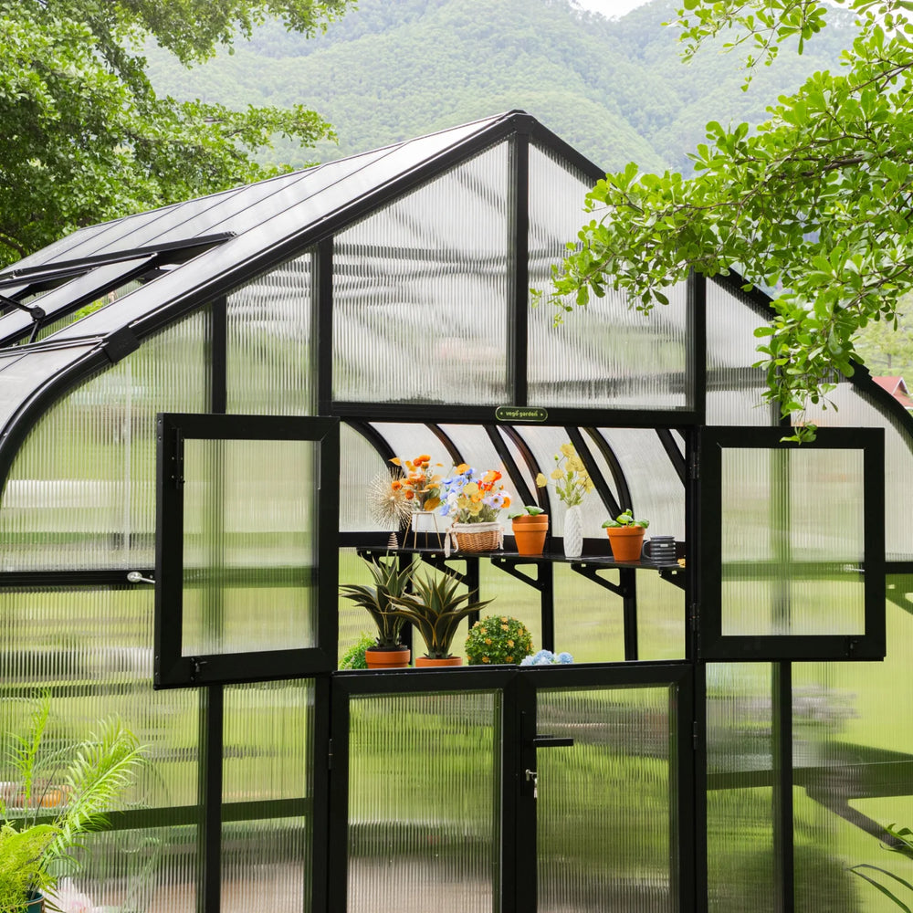 Front of the Vego Garden Pacific 12.5ft Wide Greenhouse with the upper Dutch-style door sections open.