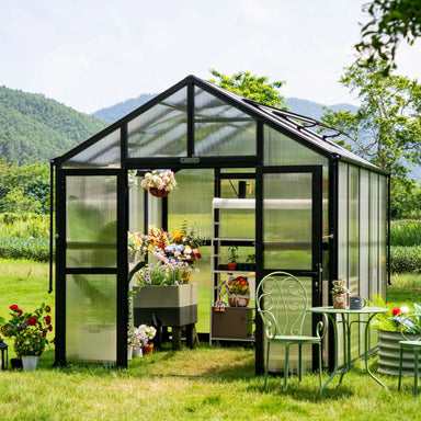 Angled exterior view of the Vego Garden Victorian Greenhouse 8.5ft Wide with polycarbonate walls, open double doors and garden seating.