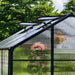 Close-up of Vego Junior Victorian Greenhouse 8ft wide showing adjustable roof vents, translucent polycarbonate panels, and black aluminum framing