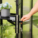 Close-up of the lockable door handle and key on the Vego Pacific 10.5ft greenhouse