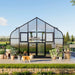 Front of the Vego Pacific 12.5ft greenhouse with the upper Dutch door panels open and a dog outside.