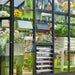 Louvered side ventilation window on the Vego Victorian Greenhouse 10.5ft Wide with plants visible behind it